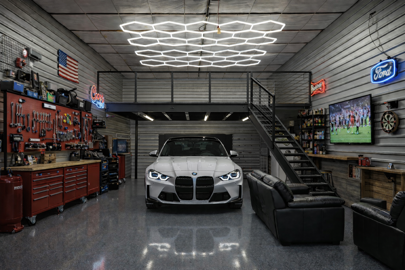 Modern Storage Caves garage condo with sports car, lounge seating, workshop wall, mezzanine, and hex lighting